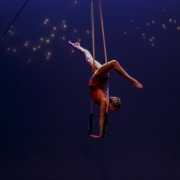 photo of a woman doing a handstand on a dance trapeze