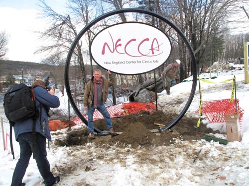 photo of the NECCA sign being raised at the new site