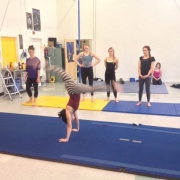 photo of a ProTrack Program student doing a front walkover in acrobatics class