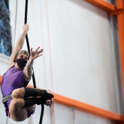 image of an aerialist training on rope